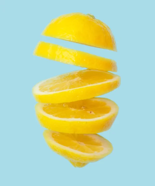 Sliced Lemon Falling Blue Background Close — Stock Photo, Image