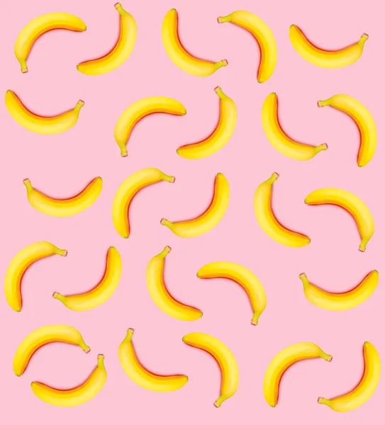 ピンクの背景の黄色のバナナ — ストック写真