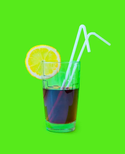 Fresh Juice glass with a straw slice of yellow lemon on a pink background. Fashion pastel summer design style concept