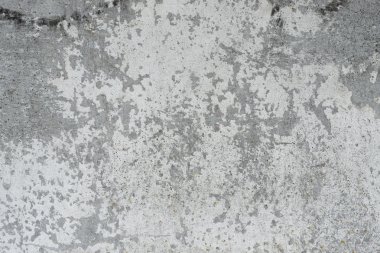 Çizik ve çatlaklarla dolu bir duvar parçası.