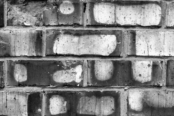 Textura de tijolo com arranhões e rachaduras — Fotografia de Stock