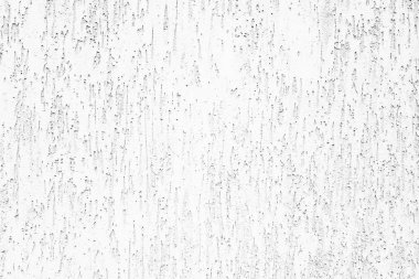 Çizik ve çatlaklarla dolu bir duvar parçası.