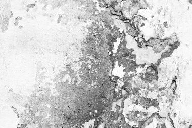 Çizik ve çatlaklarla dolu bir duvar parçası.