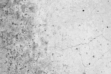 Çizik ve çatlaklarla dolu bir duvar parçası.