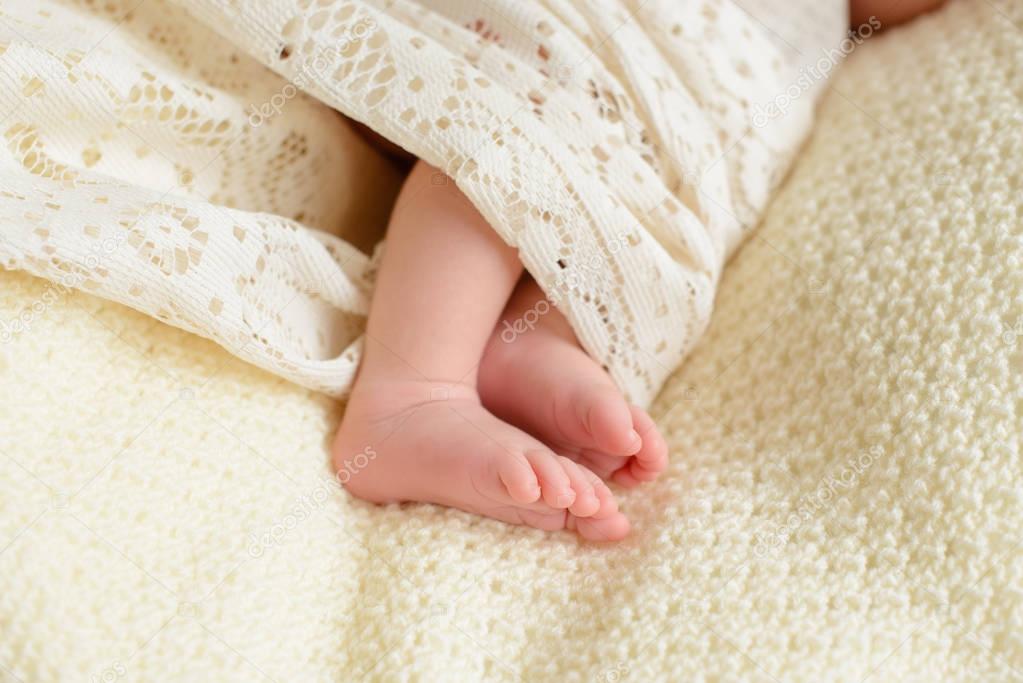 Baby feet close up. Legs of an infant