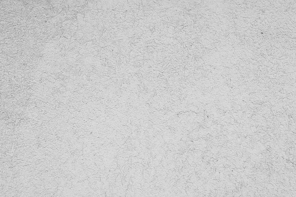 Çizik ve çatlaklarla dolu bir duvar parçası.