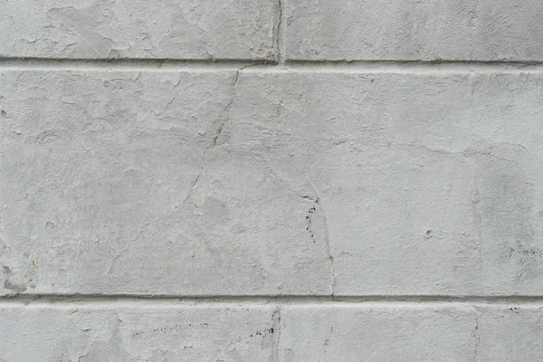 Textura de tijolo com arranhões e rachaduras — Fotografia de Stock