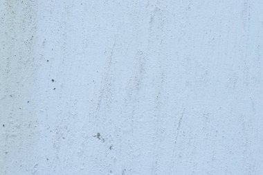 Çizik ve çatlaklarla dolu bir duvar parçası.