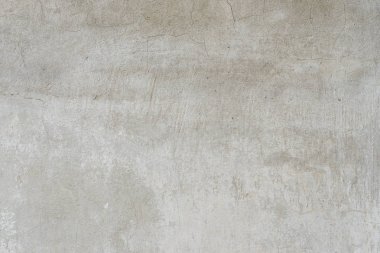 Çizik ve çatlaklarla dolu bir duvar parçası.