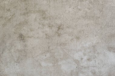 Çizik ve çatlaklarla dolu bir duvar parçası.