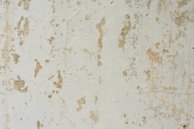 Çizik ve çatlaklarla dolu bir duvar parçası.