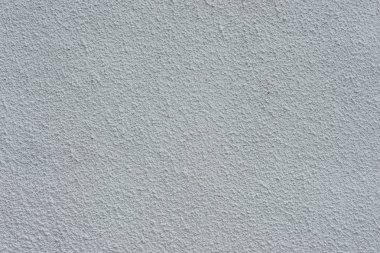 Çizik ve çatlaklarla dolu bir duvar parçası.