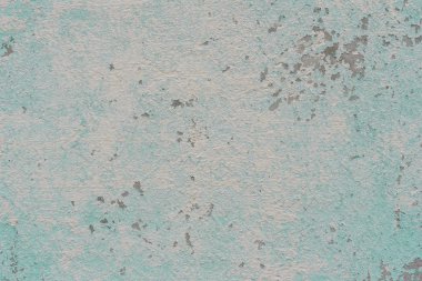 Çizik ve çatlaklarla dolu bir duvar parçası.