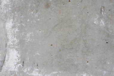 Çizik ve çatlaklarla dolu bir duvar parçası.