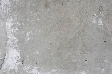 Çizik ve çatlaklarla dolu bir duvar parçası.