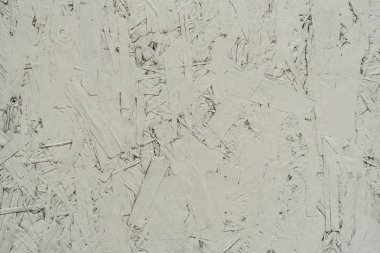 Çizik ve çatlaklarla dolu bir duvar parçası.