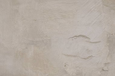 Çizik ve çatlaklarla dolu bir duvar parçası.