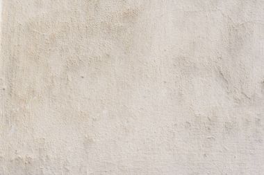 Çizik ve çatlaklarla dolu bir duvar parçası.