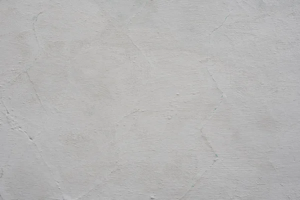 Çizik ve çatlaklarla dolu bir duvar parçası.