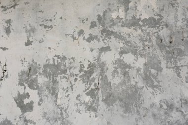 Çizik ve çatlaklarla dolu bir duvar parçası.