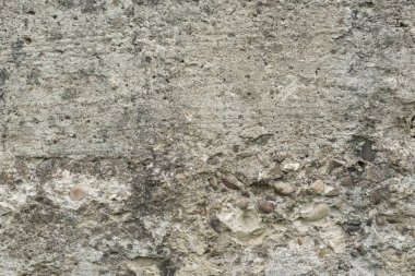 Çizik ve çatlaklarla dolu bir duvar parçası.