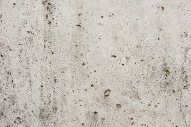 Çizik ve çatlaklarla dolu bir duvar parçası.