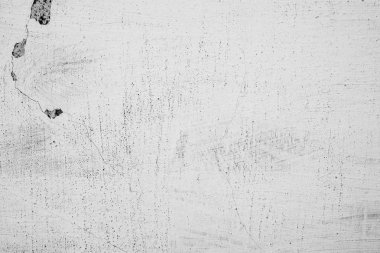 Çatlakları ve çizikleri olan beton bir duvarın dokusu arka plan olarak kullanılabilir.