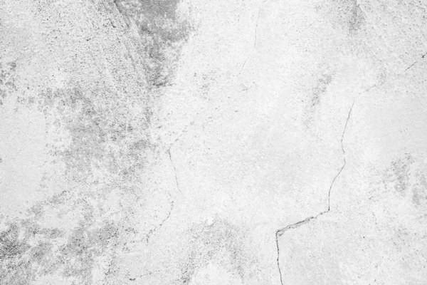 Çatlakları ve çizikleri olan beton bir duvarın dokusu arka plan olarak kullanılabilir.