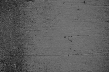 Çatlakları ve çizikleri olan beton bir duvarın dokusu arka plan olarak kullanılabilir.