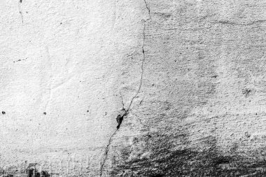 Çatlakları ve çizikleri olan beton bir duvarın dokusu arka plan olarak kullanılabilir.