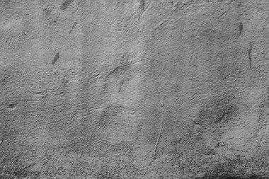 Çatlakları ve çizikleri olan beton bir duvarın dokusu arka plan olarak kullanılabilir.