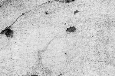 Çatlakları ve çizikleri olan beton bir duvarın dokusu arka plan olarak kullanılabilir.