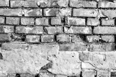 Çatlakları ve çizikleri olan tuğla duvar dokusu arka plan olarak kullanılabilir.
