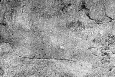 Çatlakları ve çizikleri olan beton bir duvarın dokusu arka plan olarak kullanılabilir.