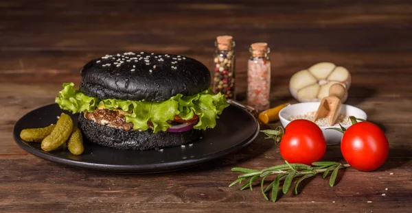 Tasty grilled homemade burger with beef, tomato, cheese, cucumber and lettuce