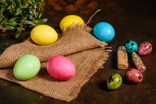 Easter cake and colorful eggs on a dark background