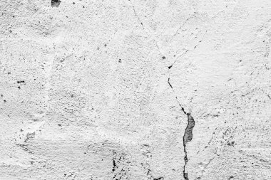 Çatlakları ve çizikleri olan beton bir duvarın dokusu arka plan olarak kullanılabilir.