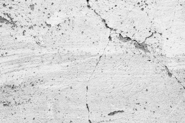 Çatlakları ve çizikleri olan beton bir duvarın dokusu arka plan olarak kullanılabilir.