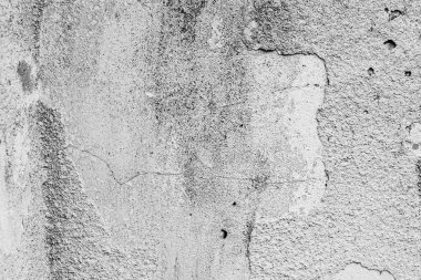 Çatlakları ve çizikleri olan beton bir duvarın dokusu arka plan olarak kullanılabilir.