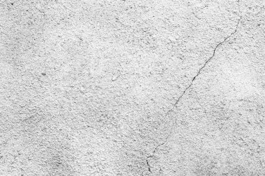 Çatlakları ve çizikleri olan beton bir duvarın dokusu arka plan olarak kullanılabilir.