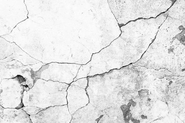 Çatlakları ve çizikleri olan beton bir duvarın dokusu arka plan olarak kullanılabilir.