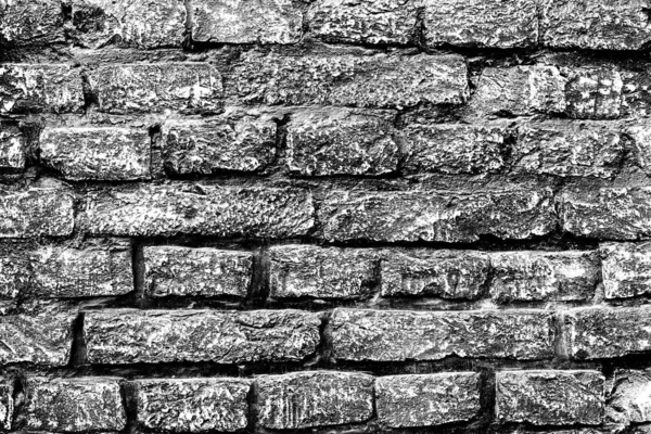 Texture of a brick wall with cracks and scratches which can be used as a background — Stock Photo, Image