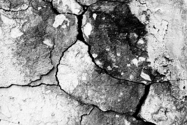 Textuur van een betonnen wand met scheuren en krassen die als achtergrond kunnen worden gebruikt — Stockfoto