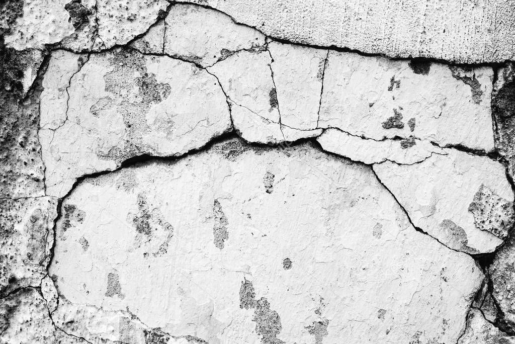 Texture of a concrete wall with cracks and scratches which can be used as a background