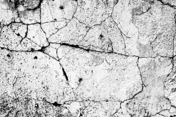 Texture d'un mur en béton avec des fissures et des rayures qui peuvent être utilisées comme fond — Photo