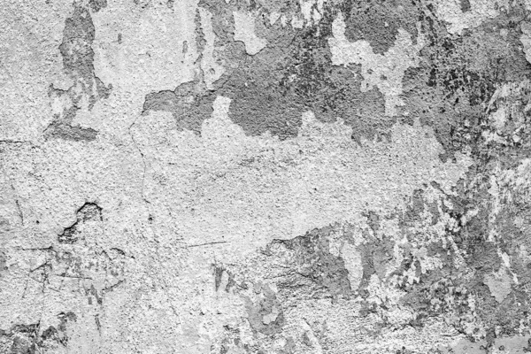 Texture d'un mur en béton avec des fissures et des rayures qui peuvent être utilisées comme fond — Photo