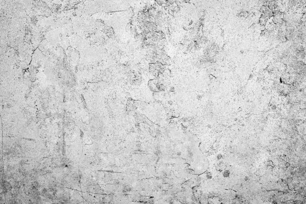 Texture d'un mur en béton avec des fissures et des rayures qui peuvent être utilisées comme fond — Photo