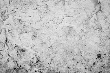 Çatlakları ve çizikleri olan beton bir duvarın dokusu arka plan olarak kullanılabilir.