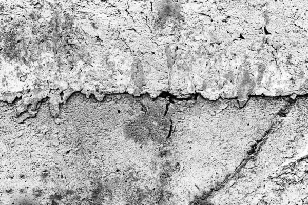 Texture d'un mur en béton avec des fissures et des rayures qui peuvent être utilisées comme fond — Photo