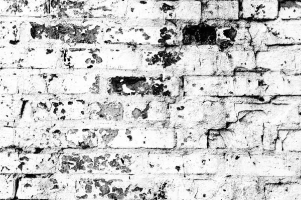 Textura de una pared de ladrillo con grietas y arañazos que se puede utilizar como fondo — Foto de Stock